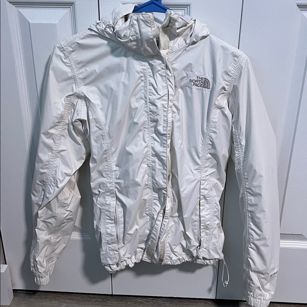 The North Face white windbreaker w/hood.